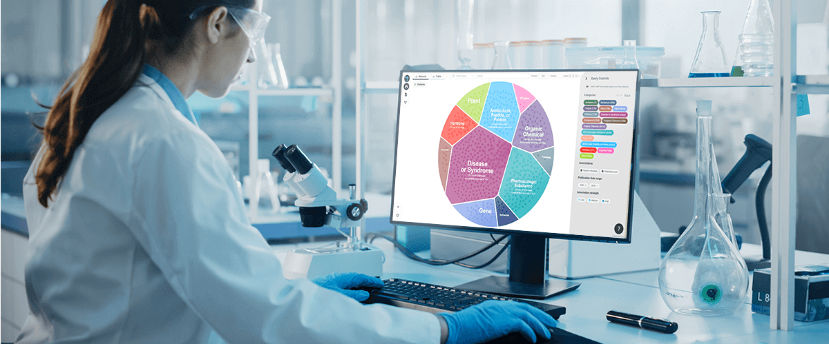 A scientist working with LEAP - the AI platform combines biomedical databases, scientific publications, clinical trials, and omics datasets